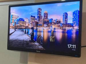 a television screen with a picture of a city at Departamento en Pomoca in Palenque