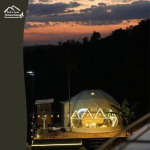 a tent with lights in it at night at Đamb'ri Top View Farmstay & Glamping in Bao Loc