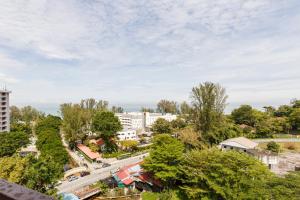 an aerial view of a city with trees and buildings at EE's Surfer's House - Seaview, 3 min walk to beach in Batu Ferringhi +30 photos