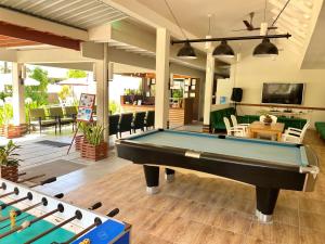 a pool table in the middle of a patio at TME Retreats Dhigurah in Dhigurah