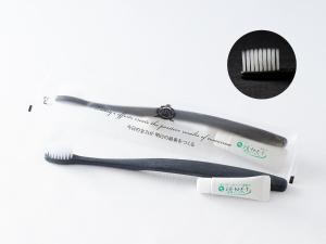 a toothbrush and a toothbrush wrapper next to a toothbrush at APA Hotel Kayabacho Hachobori Ekimae in Tokyo