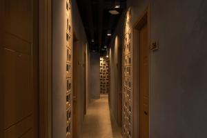 a hallway of a building with a bunch of wine racks at Cove W Suites in Jakarta