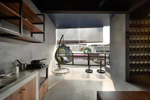 a kitchen with a large window and a table at Cove W Suites in Jakarta