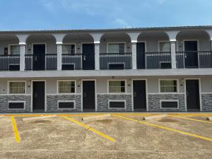 an empty parking lot in front of a building at Super 8 by Wyndham La Marque TX/Texas City Area in La Marque