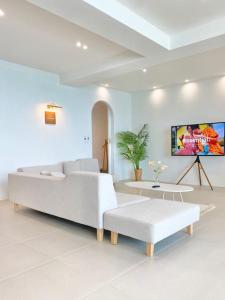 a living room with a white couch and a table at Stay moment in Busan