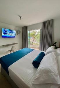 Postel nebo postele na pokoji v ubytování San Ignacio Hotel