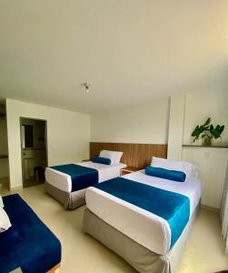 Postel nebo postele na pokoji v ubytování San Ignacio Hotel