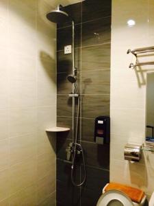 a bathroom with a shower with a toilet at Avaria Signature Hotel in Melaka
