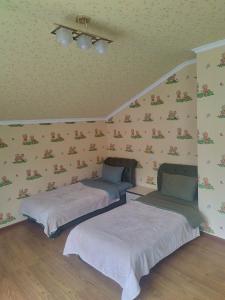 Letto o letti in una camera di Комнаты у Айрин