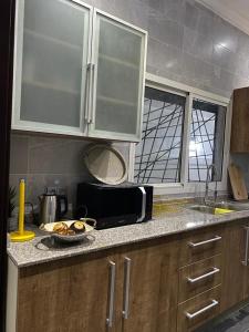 Una cocina o kitchenette en Duplex goyave