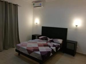 Ένα ή περισσότερα κρεβάτια σε δωμάτιο στο Appartement coup de cœur