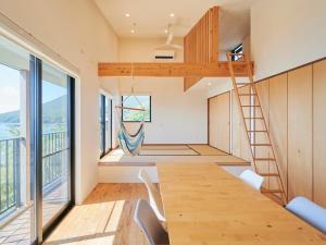 a room with a table and a loft bed at Kino-saji - Vacation STAY 89208 in Ibusuki