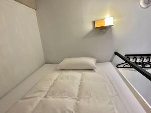 Postel nebo postele na pokoji v ubytování Taipei Sunny Hostel