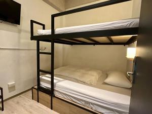 Postel nebo postele na pokoji v ubytování Taipei Sunny Hostel