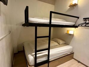 Postel nebo postele na pokoji v ubytování Taipei Sunny Hostel