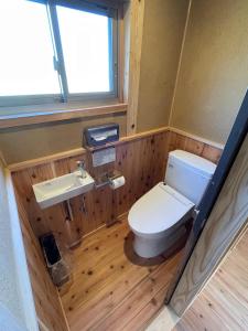 a bathroom with a toilet and a sink at 小舞庵 Komaian in Tokushima