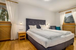 A bed or beds in a room at Ferienwohnung Mair am Bach