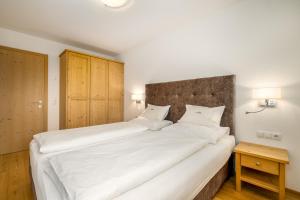 A bed or beds in a room at Ferienwohnung Mair am Bach