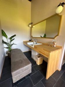 a bathroom with a sink and a mirror at ties Camp Ground Nagiso in Nagiso