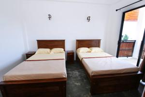 Postel nebo postele na pokoji v ubytování Shalom Bungalow