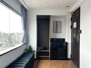 Posezení v ubytování 小隱居Hermit Dorm-聖雄商旅