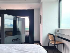 Postel nebo postele na pokoji v ubytování 小隱居Hermit Dorm-聖雄商旅