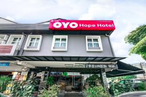 a sign on the front of a hotel at OYO 428 Hope Hotel in Johor Bahru