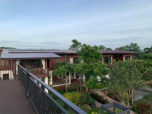 a house with a porch and a balcony at Amaze at The Myth บ้านมิตร in Mae Rim
