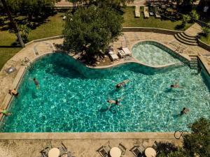 a group of people swimming in a swimming pool at Romantic Getaway in Gerakini with pool in Gerakini