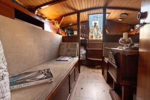 a room with a counter in a train car at Quo Vadis Yacht in Bari