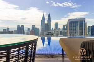 a view of the city from the rooftop of a building at The Colony & Luxe, KLCC by Five Senses in Kuala Lumpur