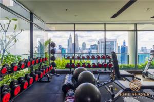 a gym with a view of the city at The Colony & Luxe, KLCC by Five Senses in Kuala Lumpur