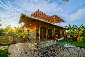 a house with a glass table in front of it at 6Tamarind in Gholvad