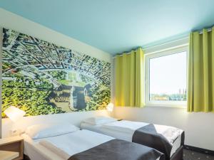 Voodi või voodid majutusasutuse B&B Hotel Karlsruhe toas