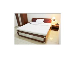 Säng eller sängar i ett rum på Hotel Shambhavi, Singrauli
