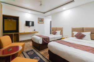 Ένα ή περισσότερα κρεβάτια σε δωμάτιο στο Hotel Ratnasambhava