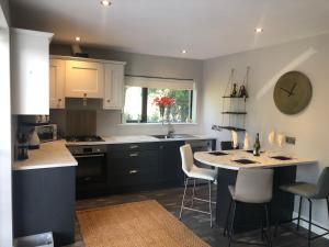 a kitchen with a island in the middle of a room at Bruíon Connemara in Cleggan