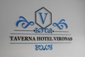 a logo for a hotel with a shield at Vironas Hotel in Himare
