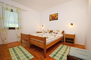 Postel nebo postele na pokoji v ubytování Apartments Tena