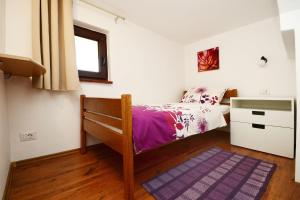 Postel nebo postele na pokoji v ubytování Apartments Tena