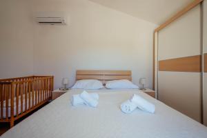 Postel nebo postele na pokoji v ubytování Villa Latica