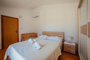 Postel nebo postele na pokoji v ubytování Villa Latica