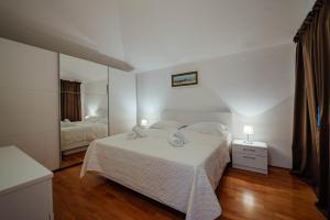 Postel nebo postele na pokoji v ubytování Villa Latica