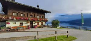 a building with a bench in front of it at Ferienwohnung Hartlgut in Bad Hofgastein