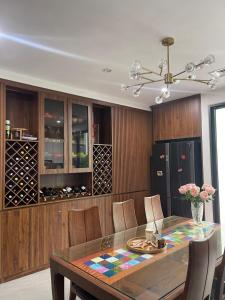 a dining room with a glass table and chairs at Alala Homestay- Tuyen Quang City Center- Trung tâm thành phố Tuyên Quang in Tuyên Quang