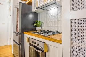 a kitchen with a stove and a refrigerator at The Bail - Belmont/ Pet Friendly in Belmont