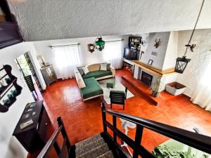 a living room with a couch and a fireplace at O Refúgio in Coimbra