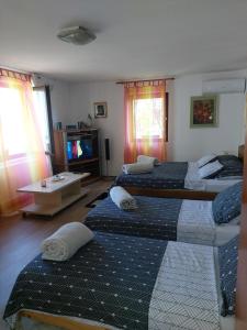 Posteľ alebo postele v izbe v ubytovaní Studio apartman KOTRO