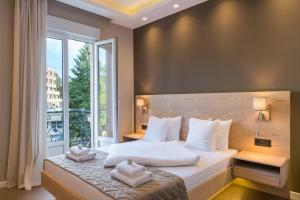 Postel nebo postele na pokoji v ubytování Emilia Lux Rooms + 37 fotografií