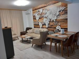 a living room with a couch and a table at Ulcinj Apartments in Ulcinj